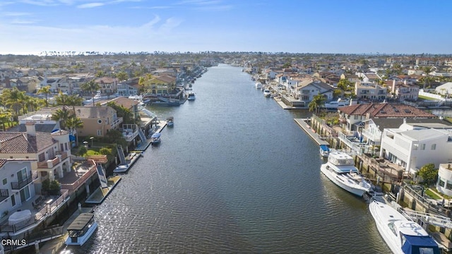 drone / aerial view with a residential view and a water view