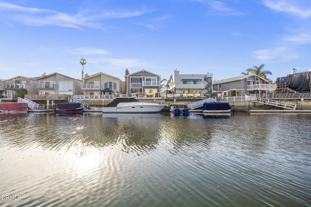 dock area featuring a residential view and a water view