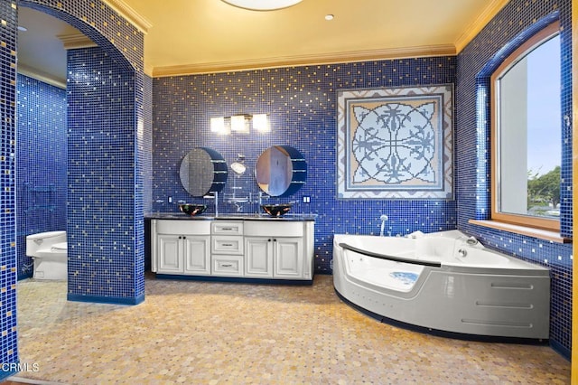 bathroom featuring crown molding, tile walls, double vanity, a sink, and a bath