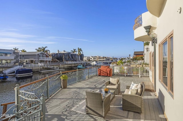 view of patio / terrace featuring a water view and an outdoor hangout area