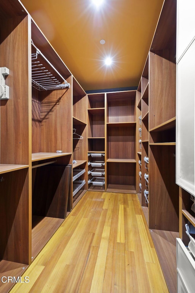 spacious closet with wood finished floors