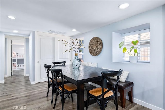 dining area with recessed lighting, visible vents, baseboards, and wood finished floors