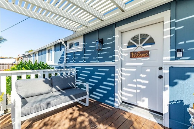 exterior space with an outdoor living space, a deck, and a pergola