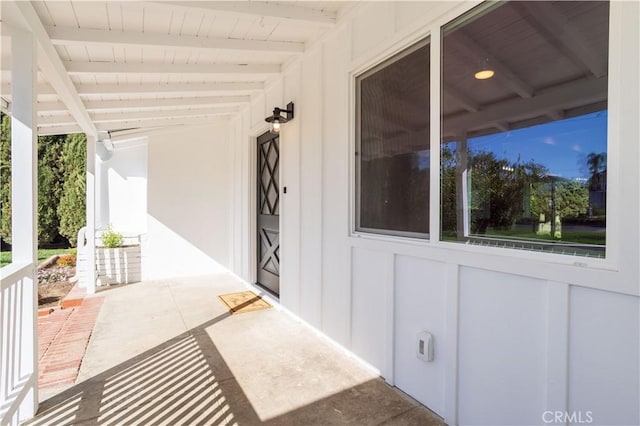 doorway to property with board and batten siding