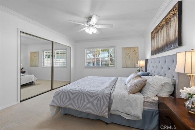 bedroom with ornamental molding, a closet, and carpet flooring