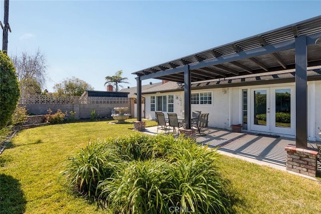 view of yard featuring french doors, a patio area, fence, and a pergola