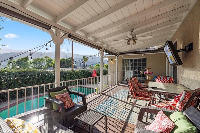 view of patio with ceiling fan, an outdoor hangout area, and a fenced in pool