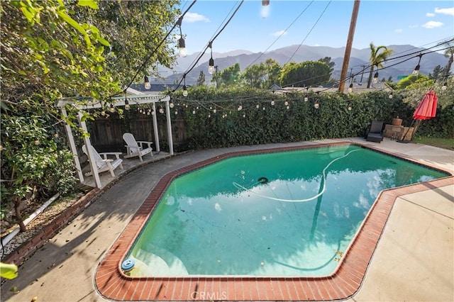 3104 Altura Ave, La Crescenta, CA 91214 - view of swimming pool with a mountain view, a fenced backyard, and a patio area