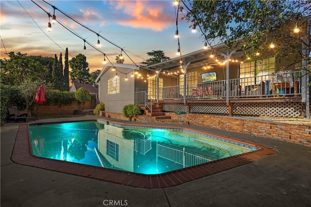 outdoor pool featuring a wooden deck