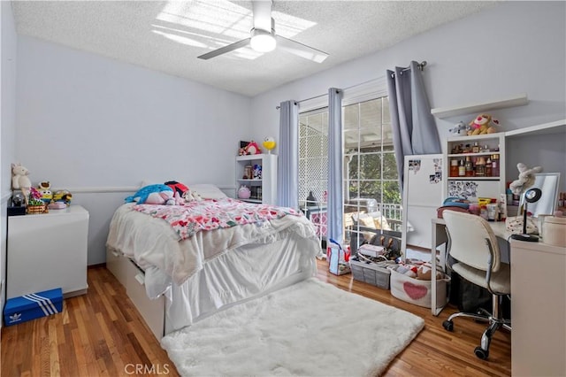 3104 Altura Ave, La Crescenta, CA 91214 - bedroom featuring wood finished floors, a textured ceiling, an office area, and a ceiling fan