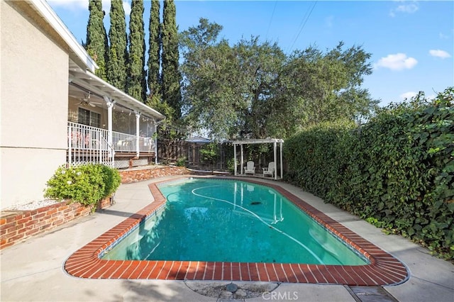 view of pool with a fenced backyard, a fenced in pool, and a ceiling fan