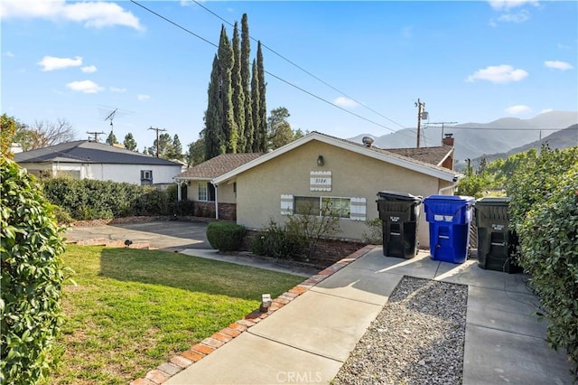 3104 Altura Ave, La Crescenta, CA 91214 - view of front of home featuring a front lawn, a mountain view, and stucco siding
