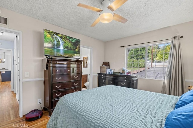 3104 Altura Ave, La Crescenta, CA 91214 - bedroom with wood finished floors, a textured ceiling, ensuite bath, and a ceiling fan
