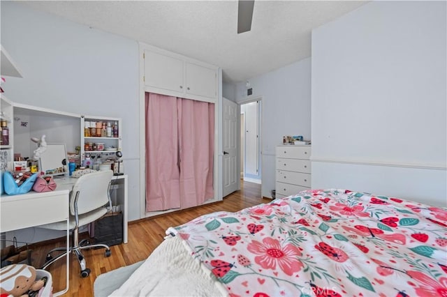 3104 Altura Ave, La Crescenta, CA 91214 - bedroom featuring an office area, light wood-type flooring, a closet, and a ceiling fan