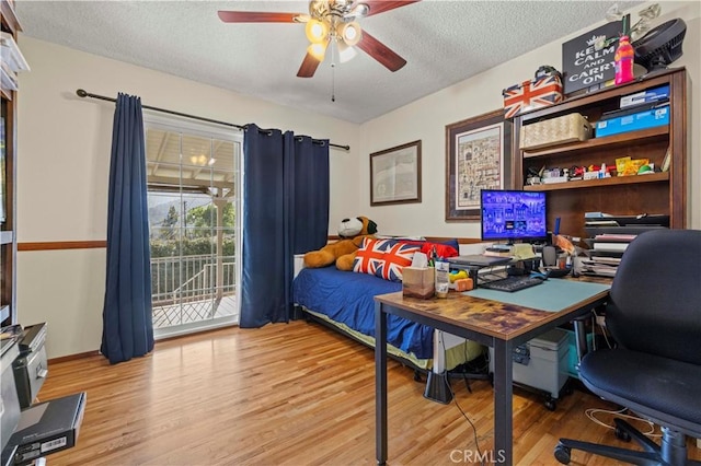 3104 Altura Ave, La Crescenta, CA 91214 - bedroom featuring access to outside, wood finished floors, an office area, a textured ceiling, and a ceiling fan