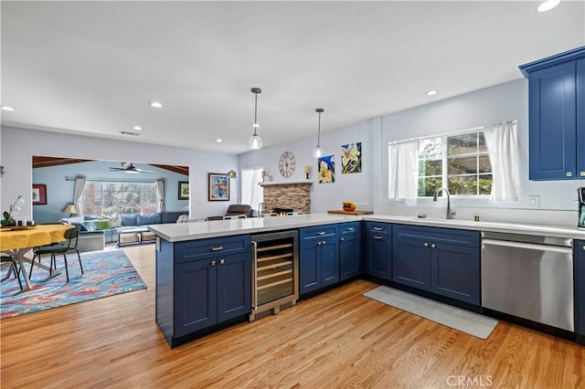 3104 Altura Ave, La Crescenta, CA 91214 - kitchen featuring stainless steel dishwasher, wine cooler, open floor plan, a peninsula, and blue cabinets