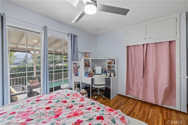 3104 Altura Ave, La Crescenta, CA 91214 - bedroom with a textured ceiling, wood finished floors, ceiling fan, and a closet