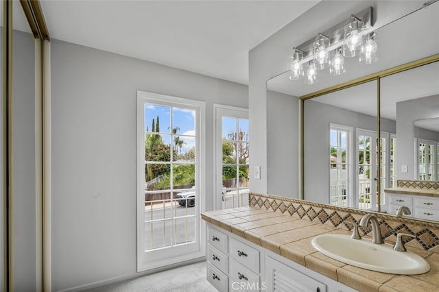 bathroom with backsplash and vanity