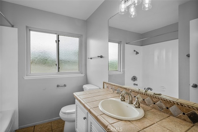 bathroom with tile patterned floors, vanity, toilet, and shower / bath combination