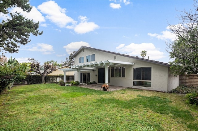 back of property with a patio, a yard, a fenced backyard, a pergola, and stucco siding