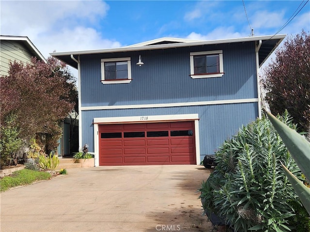 view of front of property featuring driveway and an attached garage