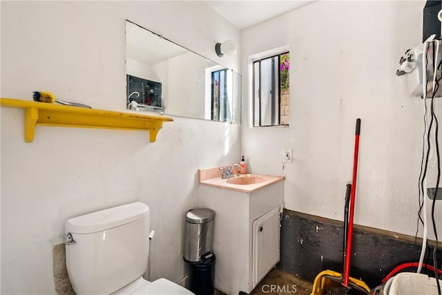 bathroom with vanity and toilet