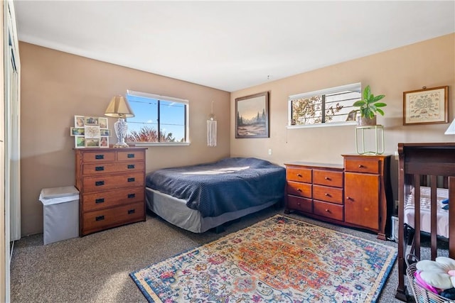 carpeted bedroom with multiple windows