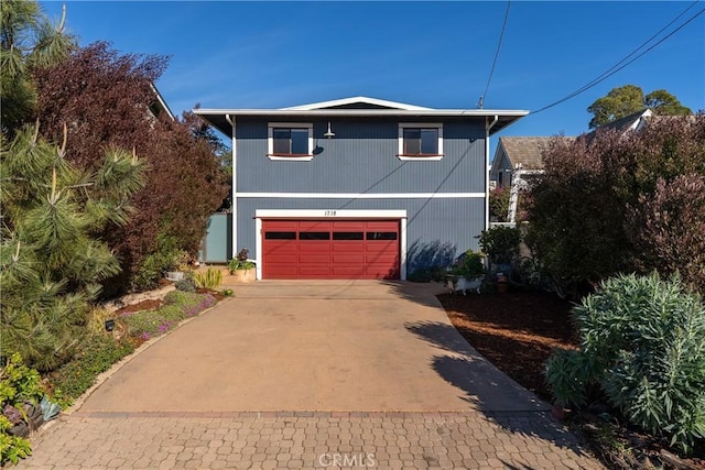 traditional-style home with a garage and driveway