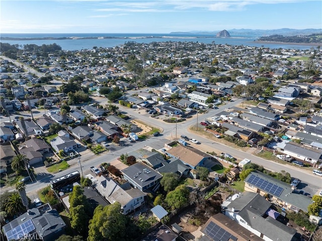 drone / aerial view with a water view and a residential view