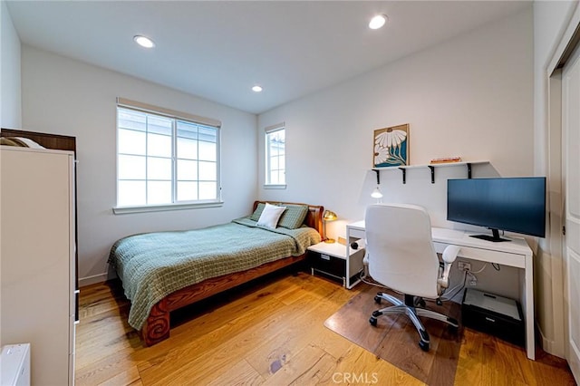 bedroom featuring recessed lighting and light wood-style flooring