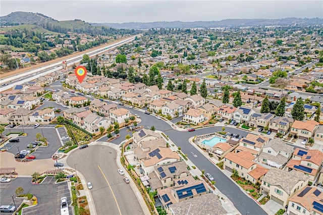 drone / aerial view with a mountain view and a residential view