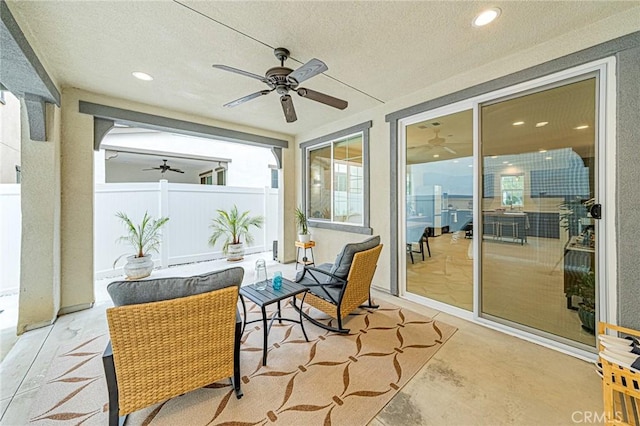 view of patio / terrace featuring a ceiling fan and fence