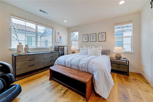 bedroom with recessed lighting, visible vents, baseboards, and light wood-style flooring