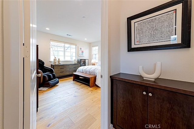 bedroom featuring visible vents, recessed lighting, and light wood-style floors