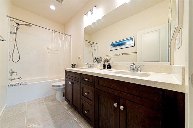 full bath with double vanity, toilet, shower / tub combo, and a sink