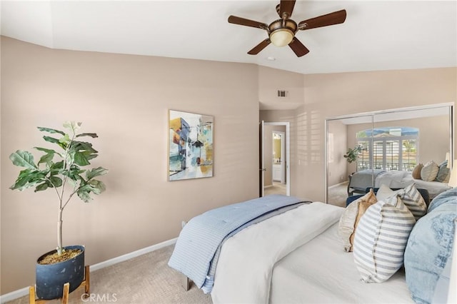 bedroom with visible vents, ceiling fan, baseboards, lofted ceiling, and carpet flooring