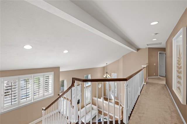 corridor with visible vents, baseboards, carpet floors, vaulted ceiling with beams, and recessed lighting