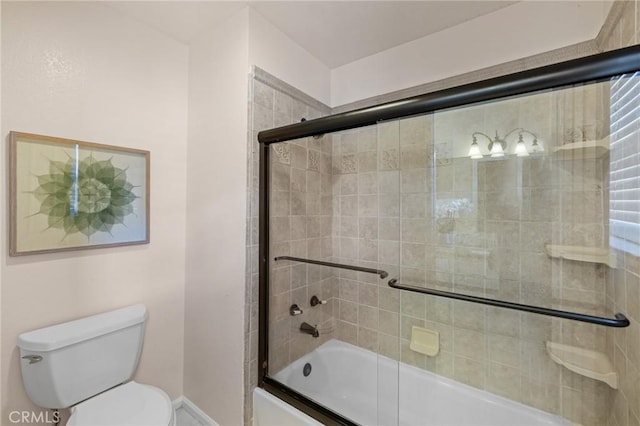 bathroom with toilet and enclosed tub / shower combo