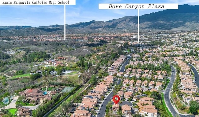 aerial view featuring a mountain view and a residential view