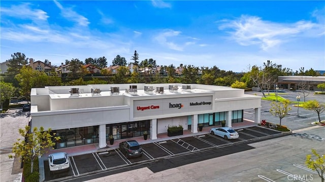 view of building exterior featuring uncovered parking