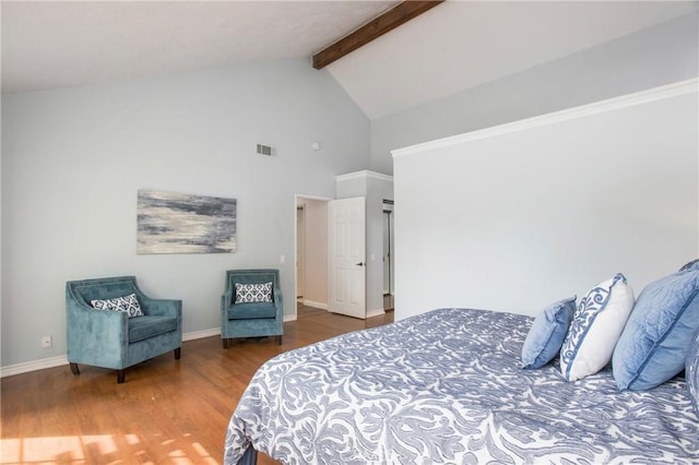 bedroom featuring beam ceiling, visible vents, wood finished floors, high vaulted ceiling, and baseboards