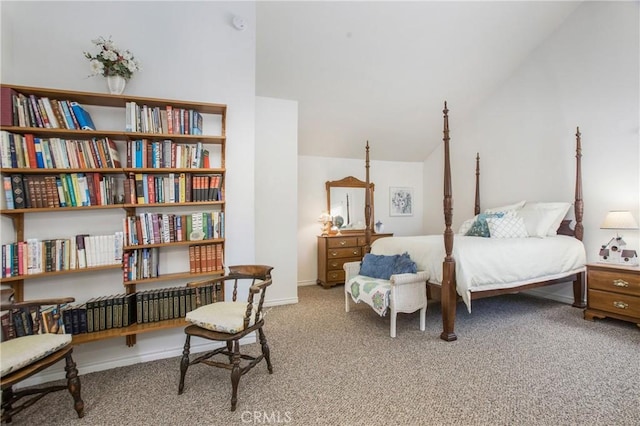 carpeted bedroom with vaulted ceiling and baseboards