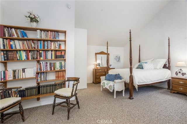 bedroom featuring vaulted ceiling and carpet