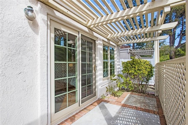 view of patio with fence and a pergola
