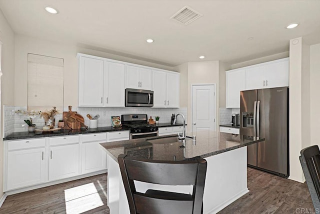 1510 Wildgrove Way, Vista, CA 92081 - kitchen featuring dark wood-type flooring, visible vents, stainless steel appliances, and a sink