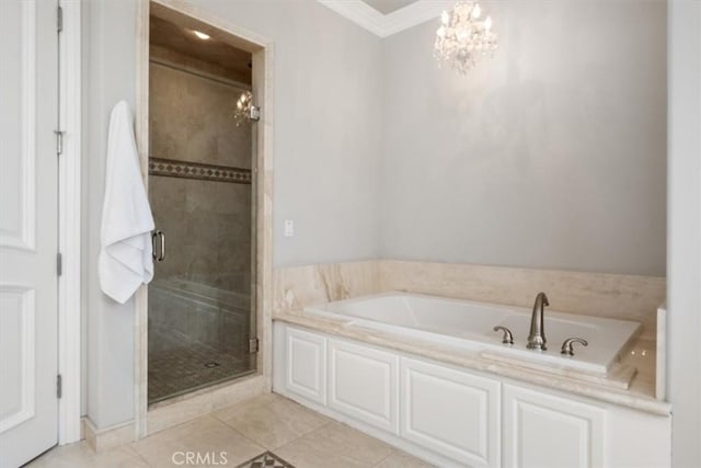 full bath with a garden tub, a notable chandelier, a shower stall, tile patterned floors, and crown molding