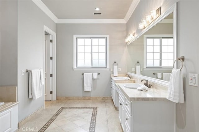 full bathroom with double vanity, ornamental molding, and a sink