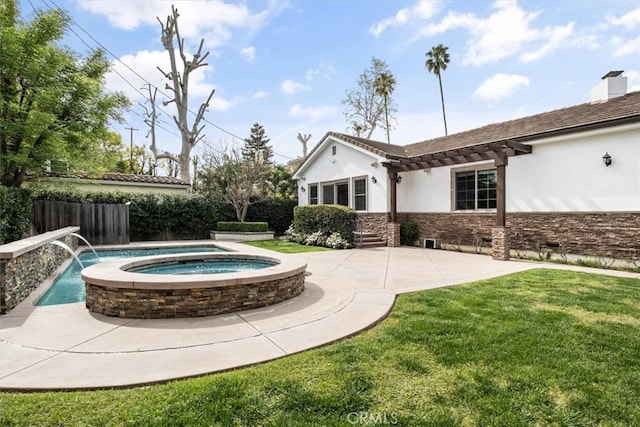 exterior space with an in ground hot tub, fence, a lawn, a pergola, and stucco siding