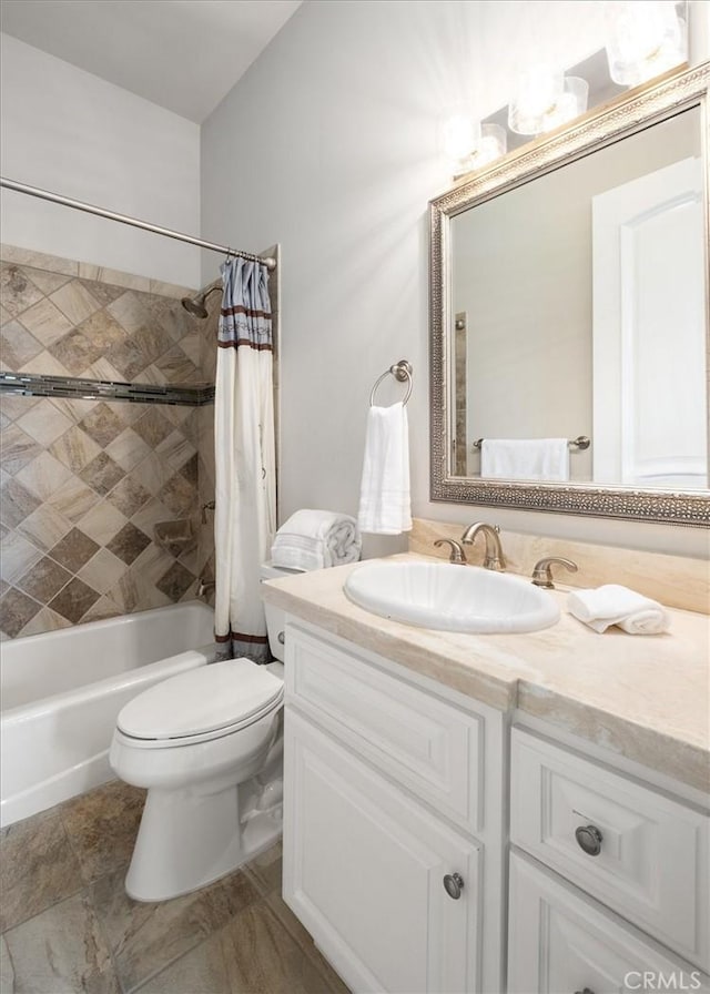 bathroom featuring shower / tub combo, vanity, and toilet