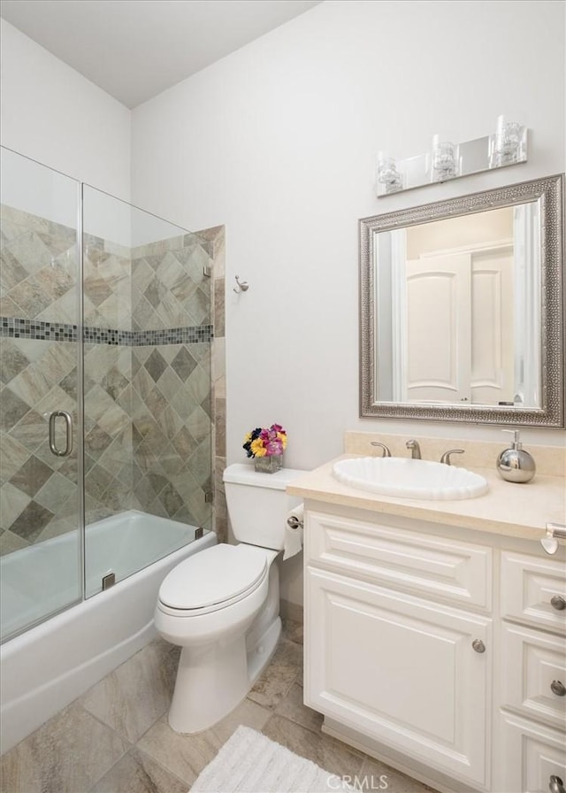 4976 Odessa Ave, Encino, CA 91436 - bathroom featuring enclosed tub / shower combo, toilet, tile patterned flooring, and vanity